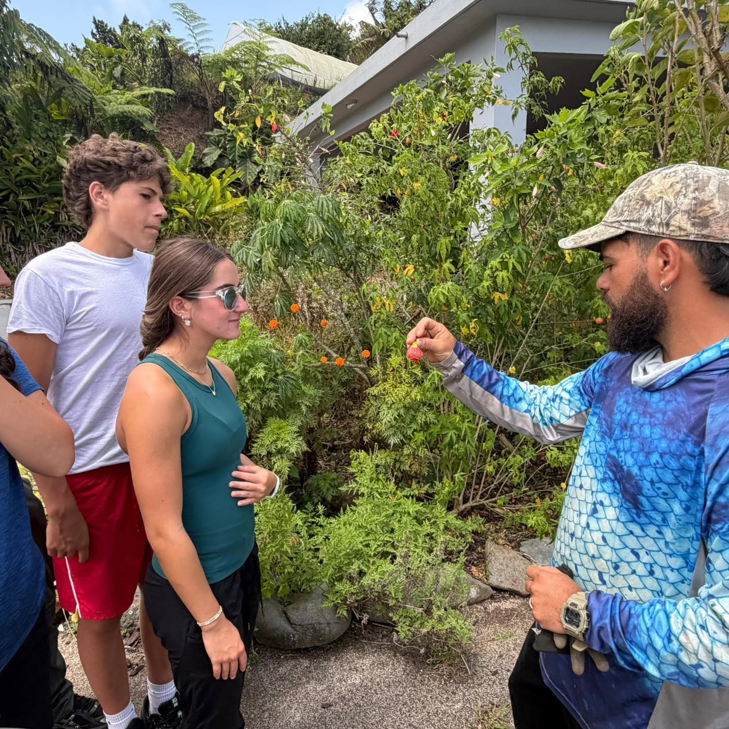 Students Shoulder to Shoulder participant learns about locally grown berries and sustainable farming during a hands-on farm visit in Costa Rica.